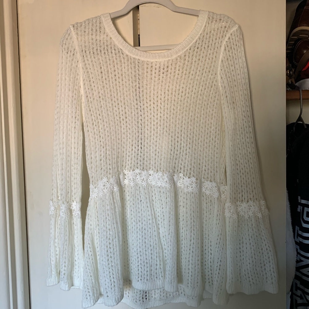 Lace trimmed peplum sweater